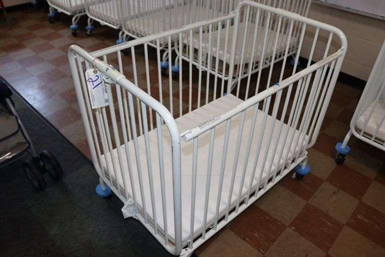 L.A. Baby white metal 2' x 3' portable baby crib with mattress