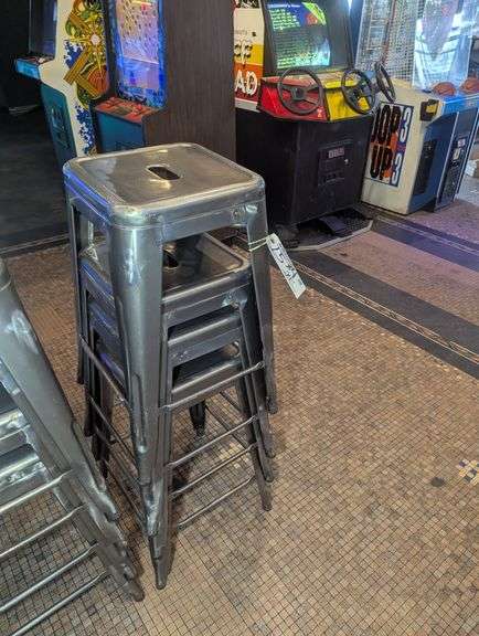 Times 4 - 24" tall silver metal bistro style stools - showing some rust - buyer to view