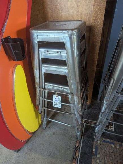 Times 4 - 24" tall silver metal bistro style stools - showing some rust - buyer to view