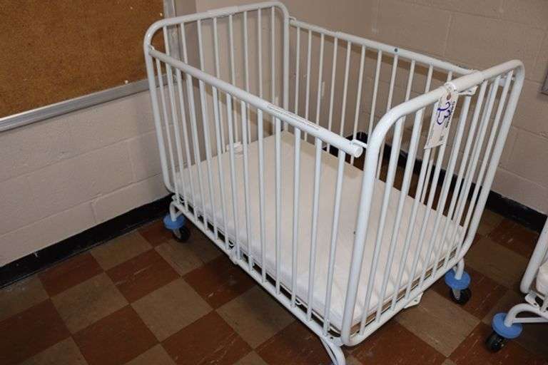 L.A. Baby white metal 2' x 3' portable baby crib with mattress