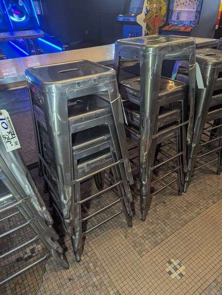 Times 4 - 24" tall silver metal bistro style stools - showing some rust - buyer to view