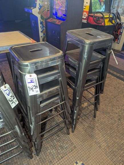 Times 4 - 24" tall silver metal bistro style stools - showing some rust - buyer to view