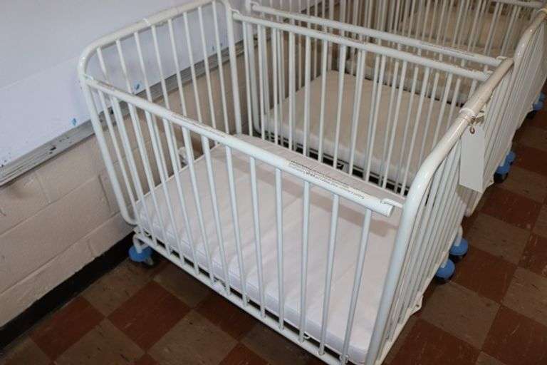 L.A. Baby white metal 2' x 3' portable baby crib with mattress