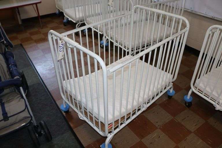 L.A. Baby white metal 2' x 3' portable baby crib with mattress