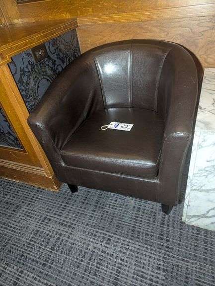 Times 2 - Brown vinyl padded armed lounge chairs