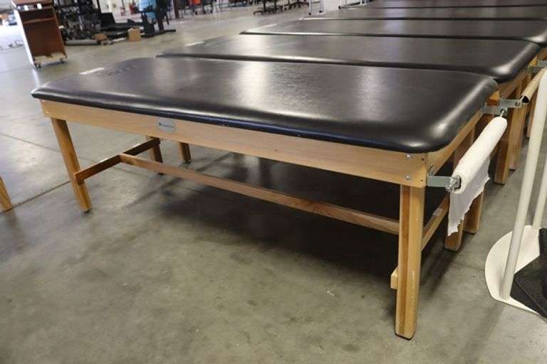 Dynatronics 30" x 84" x 30" tall wood framed black vinyl exam/rehab table - stamped UNI in top vinyl