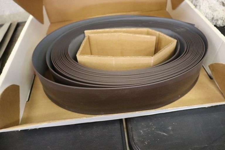 Partial roll of 4" x 1/8" thick brown vinyl wall base