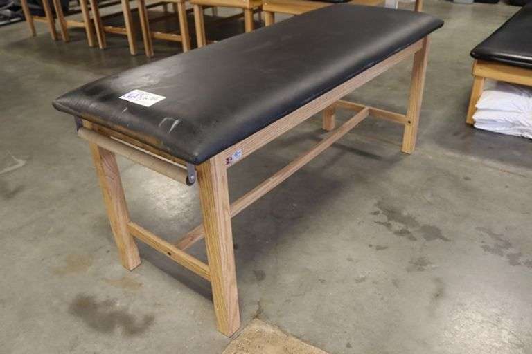 Hausmann 27" x 72" x 32" tall wood framed black vinyl exam/rehab table - stamped UNI in top vinyl