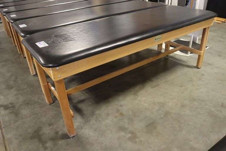 Dynatronics 30" x 84" x 30" tall wood framed black vinyl exam/rehab table - stamped UNI in top vinyl