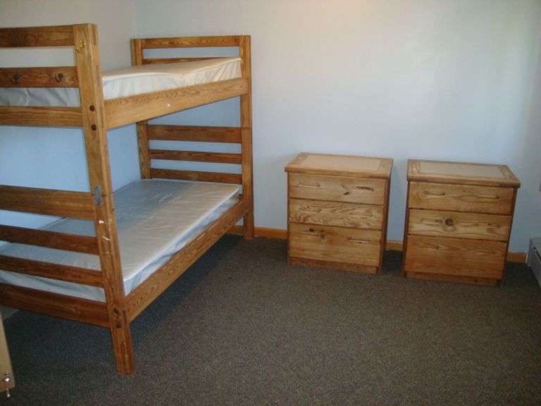 Contents of room including Well-Built Solid Fir/Pine Bunk bed, single bed, and 3 dressers Great for deer hunters cabin!