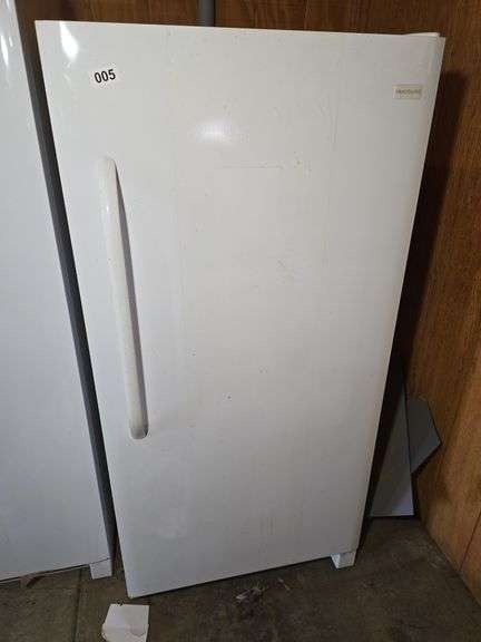 FRIGIDAIRE UPRIGHT FREEZER. 29 1/2" W X 31" D X 61 3/4" T.