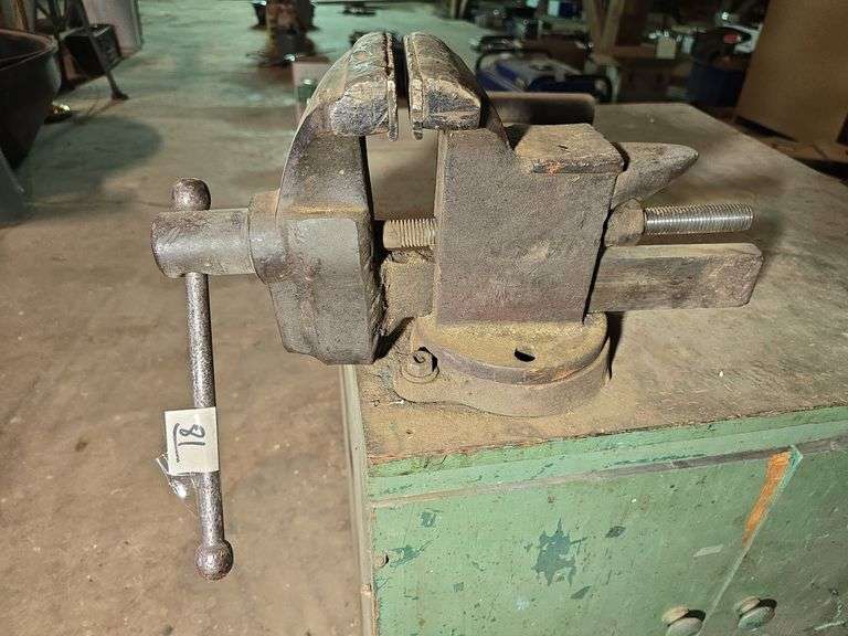 WOOD CABINET WITH NICE BENCH VISE AND CHUNK OF RAIL ROAD.