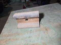 WOOD CABINET WITH NICE BENCH VISE AND CHUNK OF RAIL ROAD.