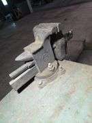 WOOD CABINET WITH NICE BENCH VISE AND CHUNK OF RAIL ROAD.