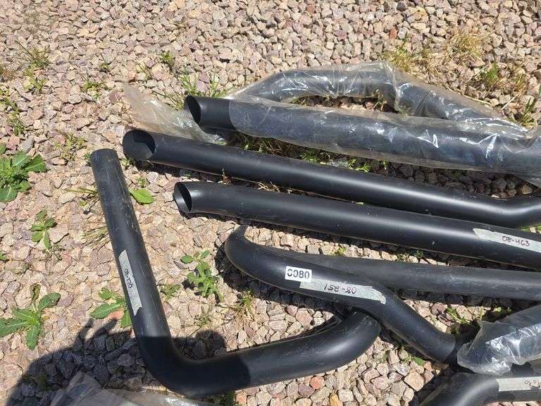 BLACK MOTORCYCLE EXHAUST PARTS.