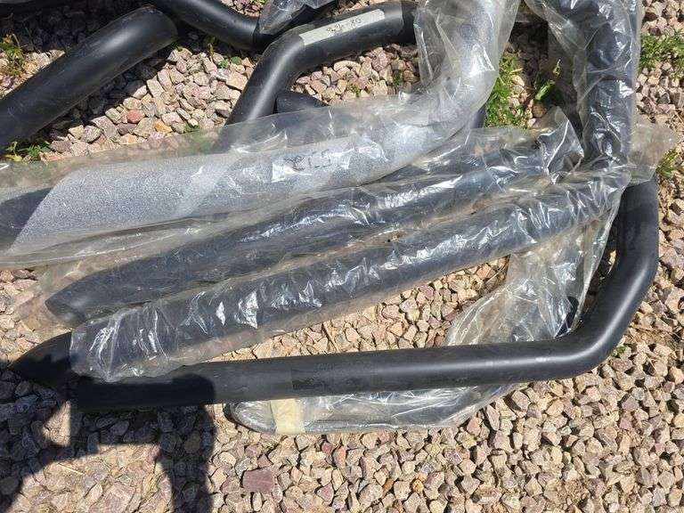 BLACK MOTORCYCLE EXHAUST PARTS.