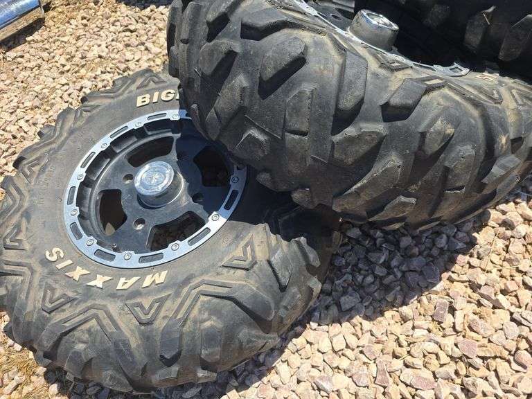 SET OF 4 POLARIS UTV TIRES AND WHEELS. NO LUG NUTS.