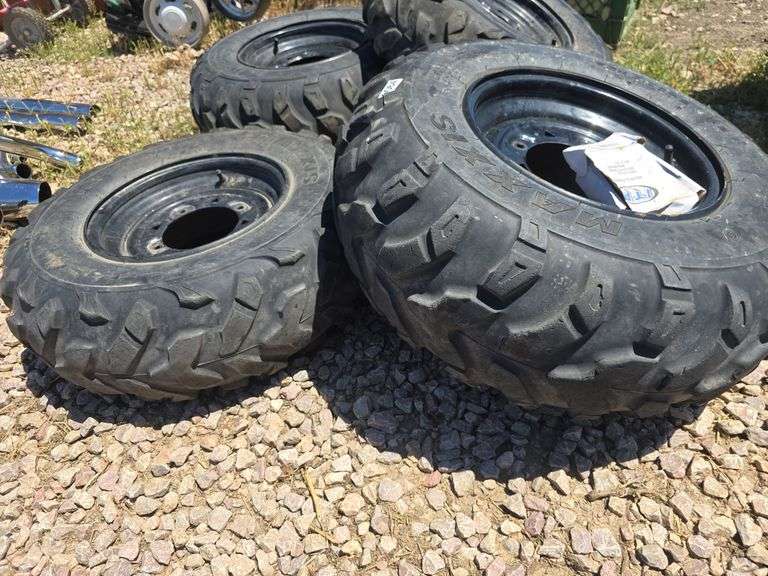 SET OF 4 POLARIS UTV TIRES WITH LUG NUTS.