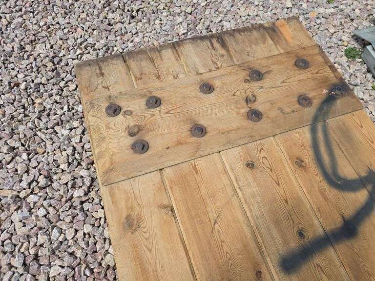 HEAVY WOODEN DOOR.