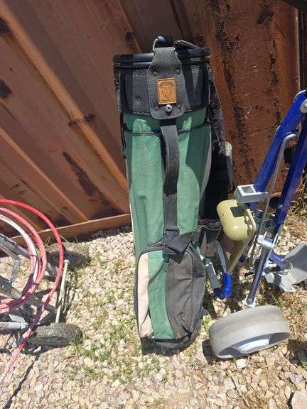 GOLF BAG AND 2 GOLF BAG CARTS.