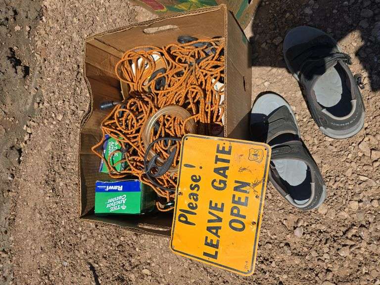 SIGN, TRUCK BED NET, SANDALS.