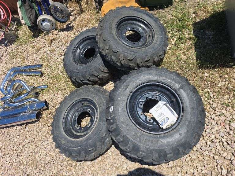 SET OF 4 POLARIS UTV TIRES WITH LUG NUTS.
