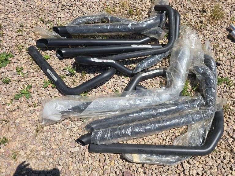 BLACK MOTORCYCLE EXHAUST PARTS.