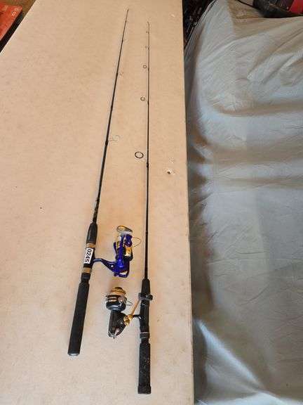 2- FISHING POLES, BLUE REEL LIGHTS UP WHEN BEING REELED.