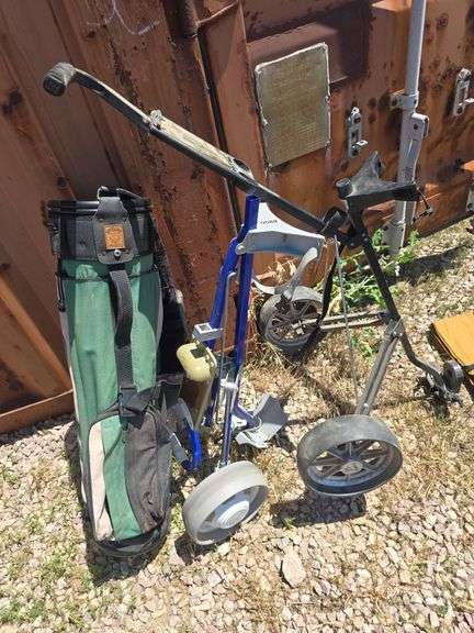 GOLF BAG AND 2 GOLF BAG CARTS.