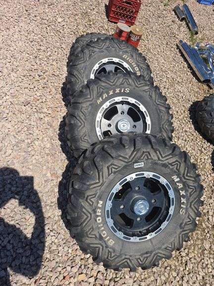 SET OF 4 POLARIS UTV TIRES AND WHEELS. NO LUG NUTS.