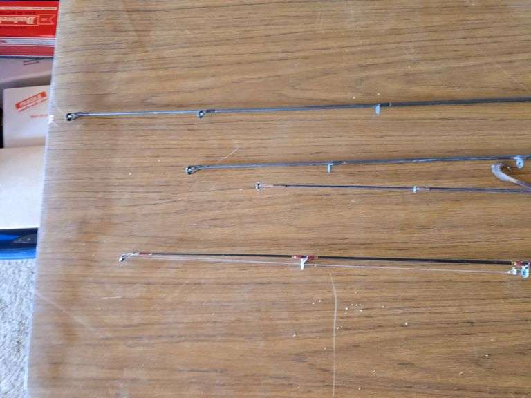 4- ZEBCO FISHING POLES WITH ZEBCO 33 REELS.