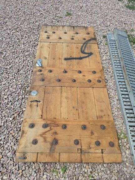 HEAVY WOODEN DOOR.