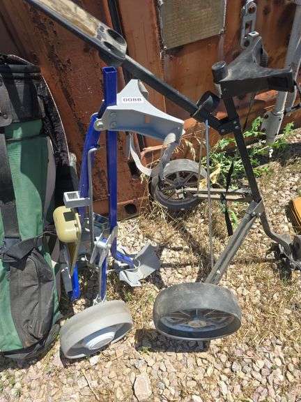 GOLF BAG AND 2 GOLF BAG CARTS.