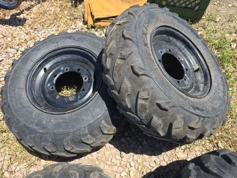 SET OF 4 POLARIS UTV TIRES WITH LUG NUTS.