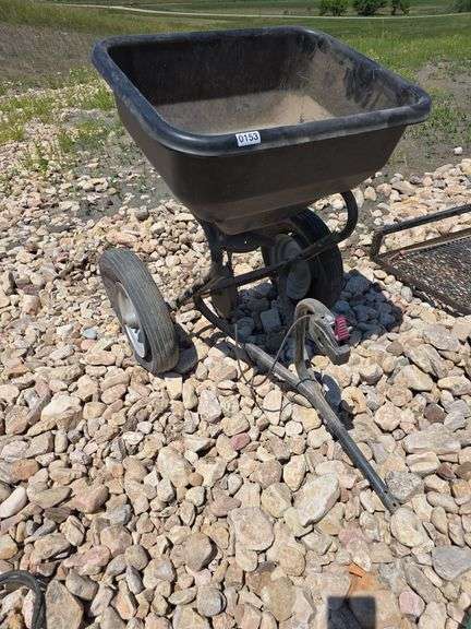 PULL BEHIND SEED/FERTILIZER SPREADER. BAD TIRES.