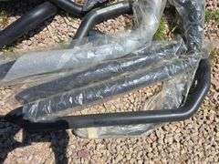 BLACK MOTORCYCLE EXHAUST PARTS.