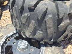 SET OF 4 POLARIS UTV TIRES AND WHEELS. NO LUG NUTS.