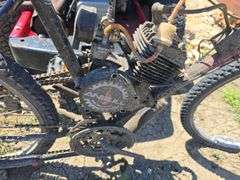 BIKE WITH ADDED ON GAS TANK AND ENGINE. RUNS, NEEDS CABLE WORK.