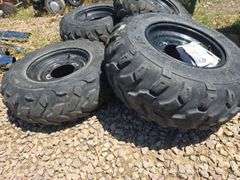 SET OF 4 POLARIS UTV TIRES WITH LUG NUTS.