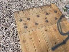 HEAVY WOODEN DOOR.