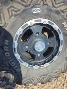 SET OF 4 POLARIS UTV TIRES AND WHEELS. NO LUG NUTS.