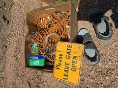 SIGN, TRUCK BED NET, SANDALS.