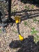 5TH WHEEL CAMPER STABILIZER TRIPOD AND 30AMP-110V ADAPTER.