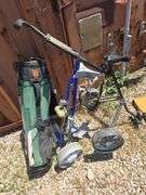 GOLF BAG AND 2 GOLF BAG CARTS.