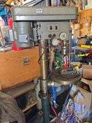 DRILL PRESS WITH VISE ON HEAVY STAND.