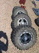 SET OF 4 POLARIS UTV TIRES AND WHEELS. NO LUG NUTS.
