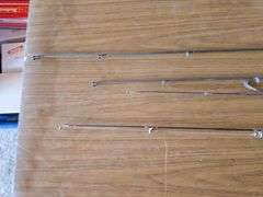 4- ZEBCO FISHING POLES WITH ZEBCO 33 REELS.