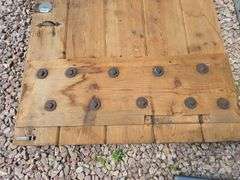 HEAVY WOODEN DOOR.