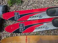 WATER SKIIS AND ROPE.