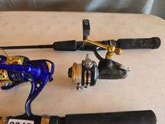 2- FISHING POLES, BLUE REEL LIGHTS UP WHEN BEING REELED.